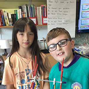 children doing a science experiment with K'nex