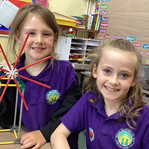 children doing a science experiment with K'nex